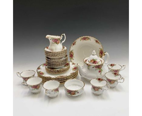 A Royal Albert 'Old Country Roses' tea and dinner service comprising tea pot, milk jug, sugar bowl, six teacups, seven saucer