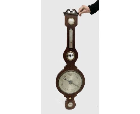 A Victorian rosewood wheel barometer with broken arch pediment and silvered dials. Overall height 108cm, the diameter of the 