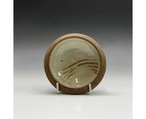Leach pottery, A small dish, the celadon ground with incised decoration, diameter 11cm.