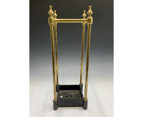 A brass four section umbrella or stick stand with turned finials and black painted base. Height 61cm.Condition report: No con