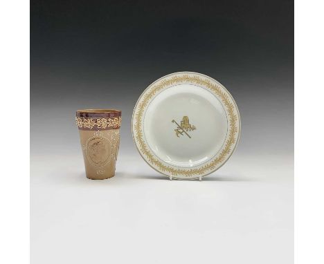 A 19th century Wedgwood pearlware dessert plate, monochrome painted with a grindstone, axe, scythe and other implements, with