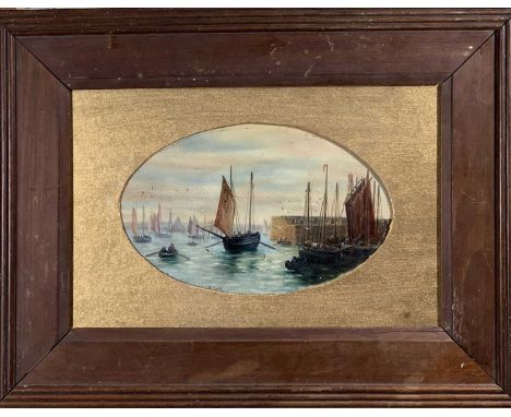 An oil painting showing the mouth of Newlyn Harbour thronging with fishing boats and St Michaels Mount beyond.Signed K. Cade.