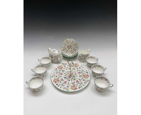 A Minton 'Haddon Hall' pattern tea service - six place settings - comprising teapot, milk jug, cake plate, and six teacups an