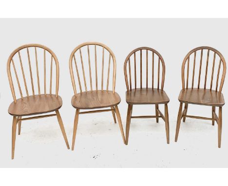 An ercol light elm dining table, a set of four elm and beech dining chairs, stamped 'BS AF 1960, 2056' and two similar later 