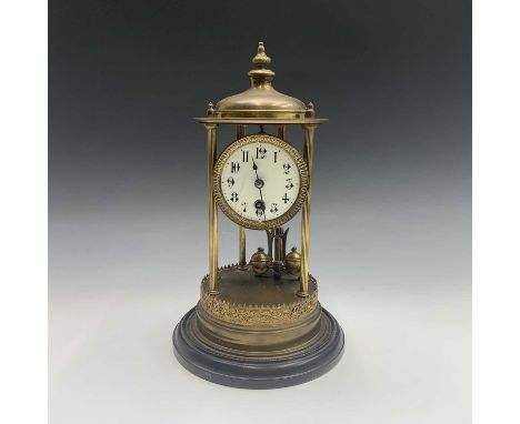 A German 400 day torsion anniversary clock of portico type, with six fluted column supports. Height 39cm.