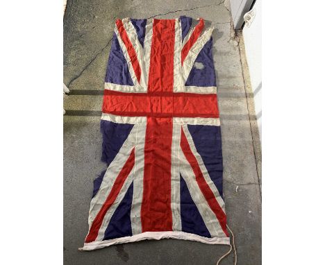 A collection of linen flags, to include three Union flags, St George, 97cm X 176cm, RNLI, Stars and Stripes, Australia, New Z