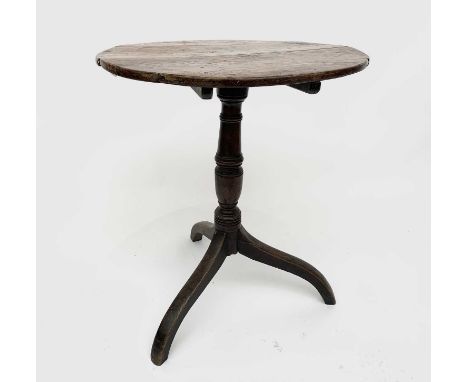 A George III oak tripod table, height 68cm, diameter of top 55.5cm.Condition report: joints are firm and top is stable. Evide