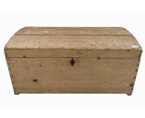 A Victorian pine domed top trunk, height 48cm, width 97.5cm.