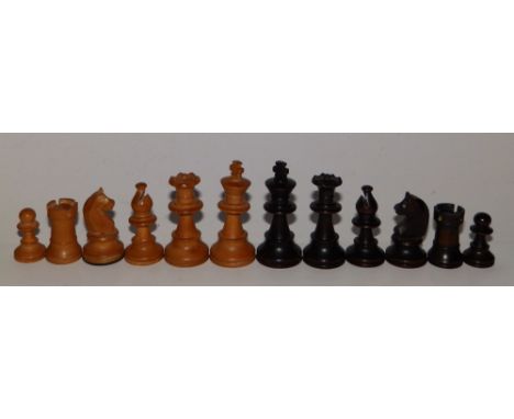 An assembled carved wooden chess set, the kings 2.6” high, contained in a Staunton box.