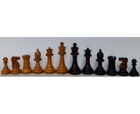 An assembled boxwood chess set, the kings 4” high.