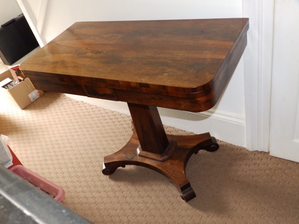 A 19thC rectangular rosewood folding pedestal card table, 36” wide.