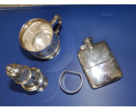 A modern Birmingham silver christening cup, a presentation silver hip flask – small dents, a damaged caster and a napkin ring