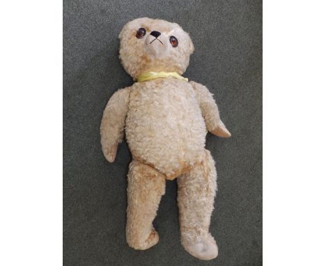 A large jointed limb teddy bear with growler.