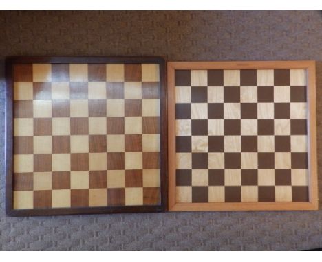 26 wooden draughts pieces together with three chess boards.