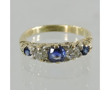 An 18 carat gold sapphire and diamond ring