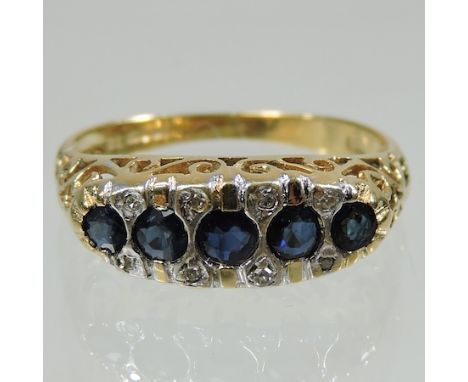 An 18 carat gold sapphire and diamond boat shaped ring