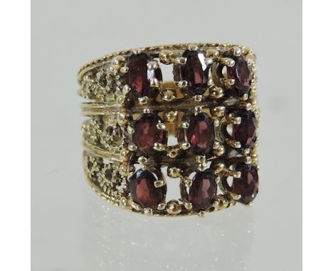 A 14 carat gold garnet dress ring