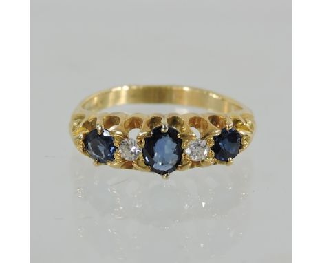 An 18 carat gold sapphire and diamond boat ring