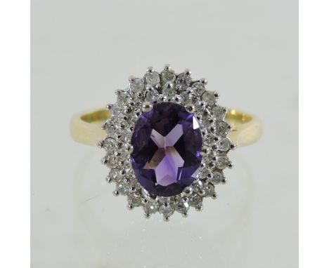 An 18 carat gold amethyst and diamond cluster ring