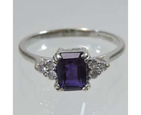 An 18 carat white gold amethyst and diamond ring