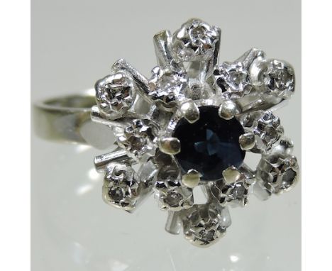 An 18 carat white gold sapphire and diamond cluster ring