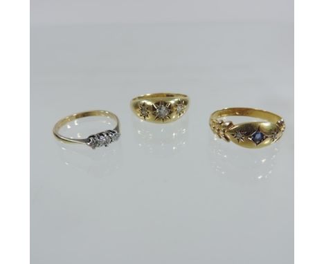 An 18 carat gold and diamond set gypsy ring, together with a diamond three stone ring and a 15 carat gold ring