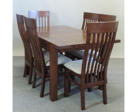 A modern oak dining table, 161 x 90cm, together with a set of six stick back dining chairs