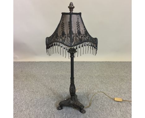 A black painted table lamp and shade, 77cm tall