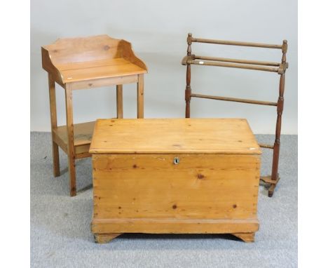 An antique pine trunk, 84cm, together with a small pine washstand and a towel airer