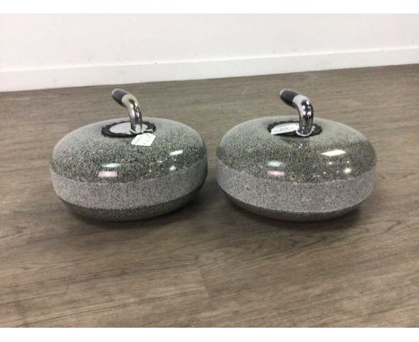 PAIR OF GRANITE CURLING STONES,with chrome plated and ebonised handlesGenerally good, with light wear.