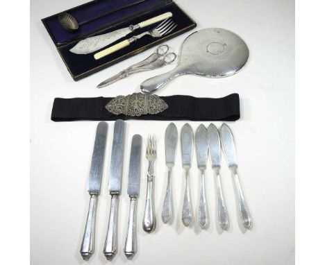 An early 20th century silver hand mirror, Chester 1910, 28cm long, together with an ornate nurse's belt, a silver toddy ladle