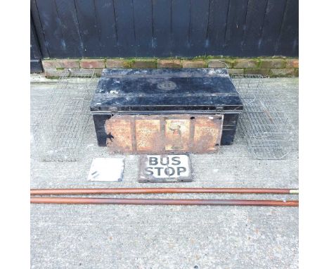 A metal trunk, together with various enamel signs, two wirework humane animal traps and two window poles91w x 57d x 32h cm
