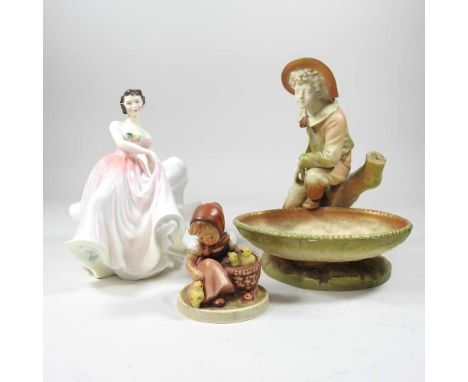 A Worcester blush ivory porcelain figural bowl, circa 1903, shape 1177, 22cm high, together with a Royal Doulton figure The P