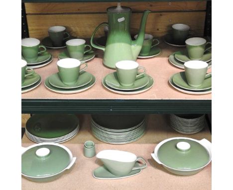 An extensive Poole pottery green glazed tea and dinner service, comprising approximately one-hundred pieces in two similar de