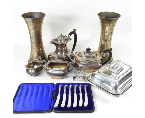 An early 20th century silver plated tea service, together with a pair of Indian vases, entree dishes and cased silver handled