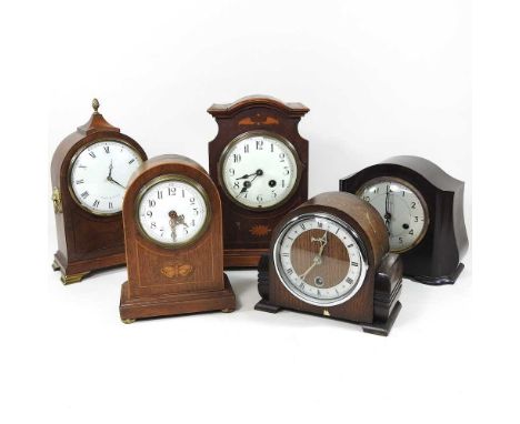 An early 20th century mahogany and inlaid mantel clock, 29cm high, together with four other clocks (5)