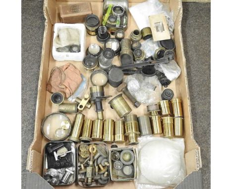A box of microscope lenses and other items