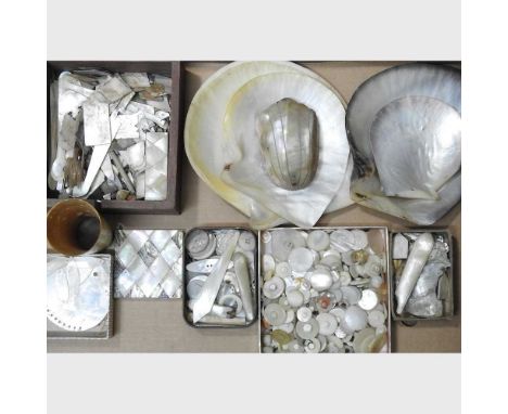 A box of mother of pearl shells and parts