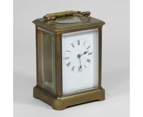 A brass cased carriage clock, with an enamel dial, 13cm high