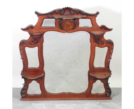 A Victorian carved mahogany over mantel mirror, decorated in relief with a portrait medallion of Queen Victoria138w x 123h cm