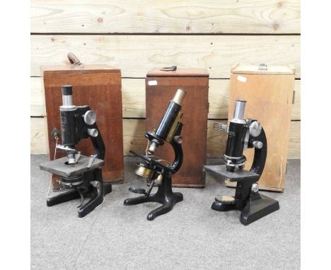 A late 19th century microscope, by W. Watson &amp; Sons, London, 33cm high, in a fitted mahogany case, together with two othe