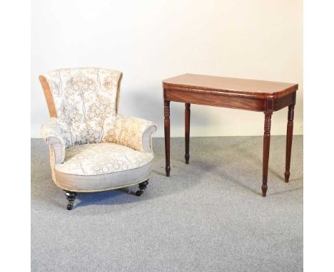 A Regency mahogany folding tea table, on ring turned legs, 92cm wide, together with a Victorian cream upholstered armchair, o