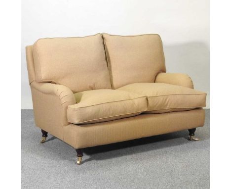 A Jayrest beige herringbone tweed upholstered two seater sofa, on turned legs134w x 95d x 94h cmOverall condition is clean wi