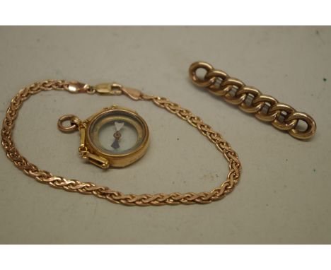 A gold pendant compass; together with a gold bracelet; and a gold bar brooch, all hallmarked 375, 9.2g total weight. 