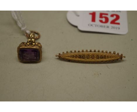 A yellow metal fob seal set carved amethyst,&nbsp;of galleon upon a sphere with trailing flower;&nbsp;together with a 9ct gol