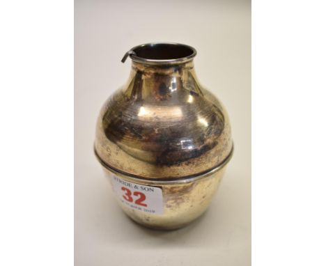 An Arabic white metal olive oil vessel and ladle, 10cm high. 