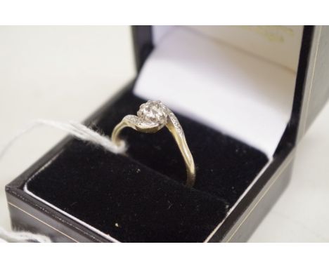 An old cut solitaire diamond ring,&nbsp;having diamond twist shoulders, in unmarked yellow metal,&nbsp;estimated 0.4ct, 3g to