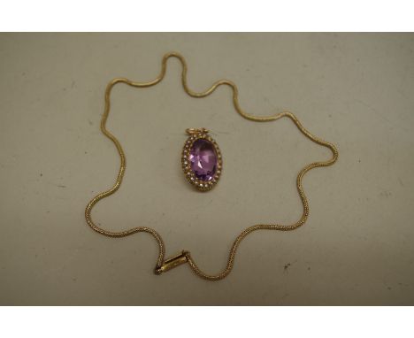 An oval amethyst and pearl pendant, stamped 15ct; together with an unmarked yellow metal chain. 
