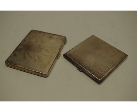 A silver crested cigarette case, by&nbsp;William Neal &amp; Co Ltd,&nbsp;Birmingham 1933; together with another engine turned