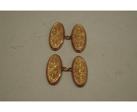 A pair of oval engine turned rose gold cufflinks,&nbsp;hallmarked 375, 4.6g. 